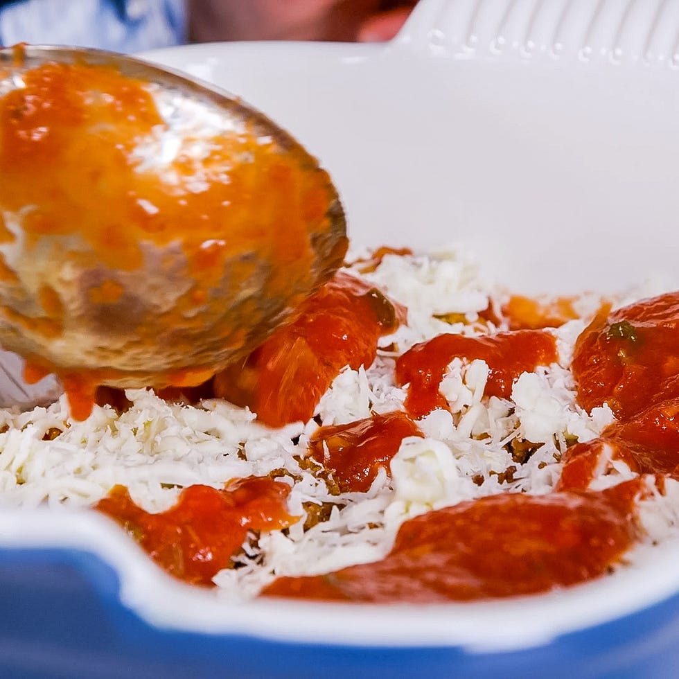 serving a dish with shredded cabbage and tomato sauce