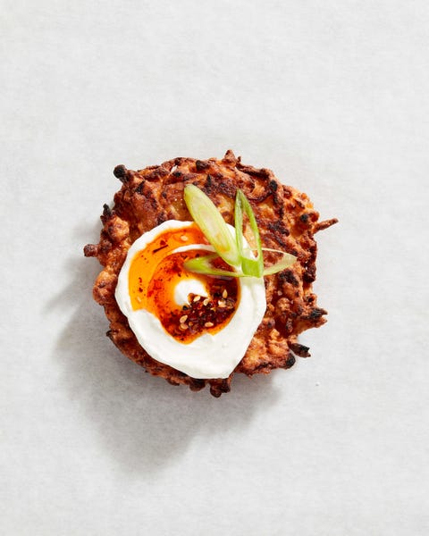 latkes with greek yogurt, chili oil, and scallions  delishcom