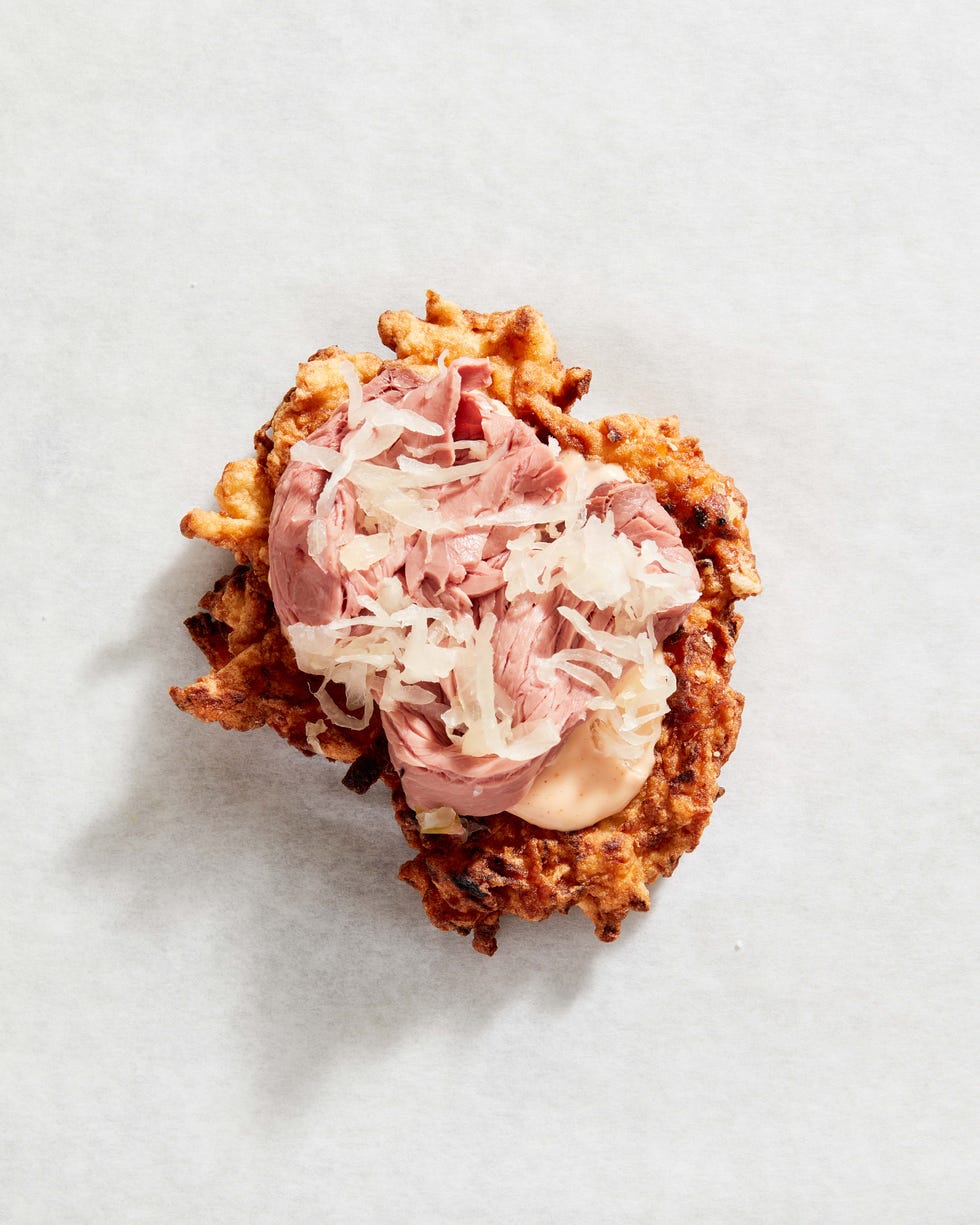 latkes with roast beef  sauerkraut and russian dressing  delishcom