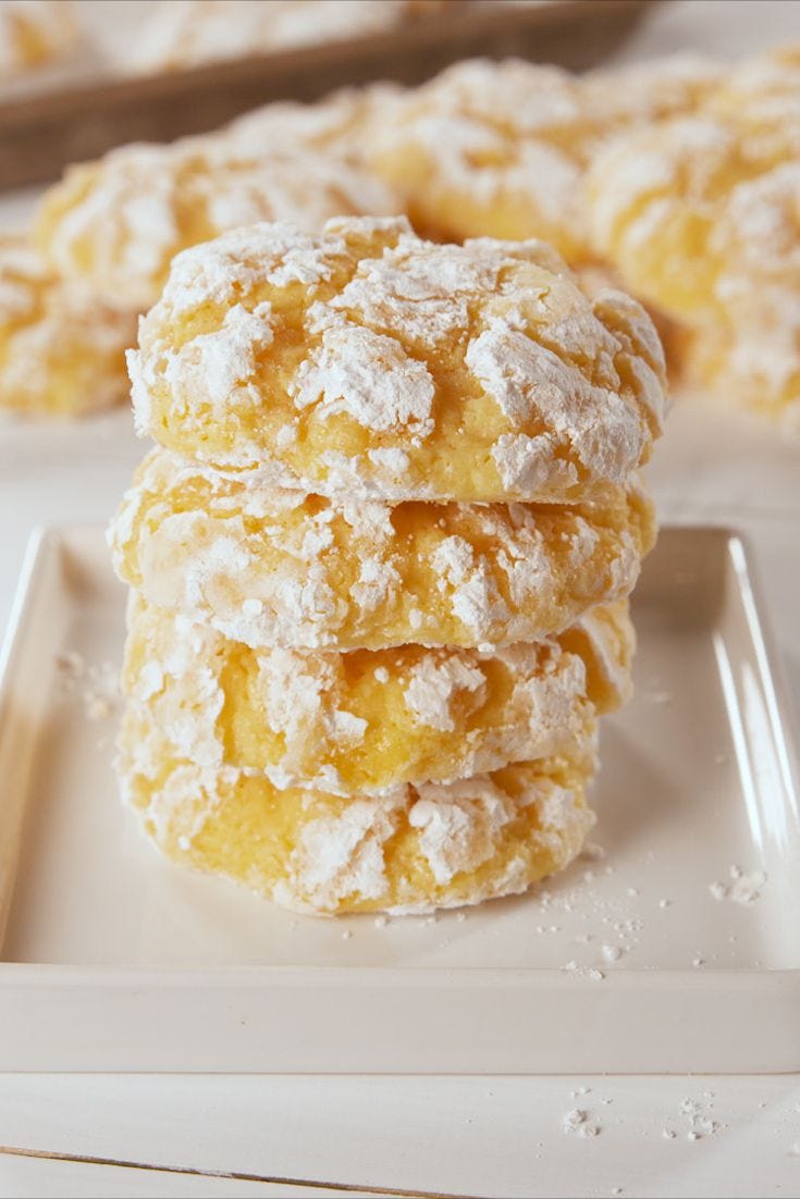 stacked lemon butter cookies on a white plate