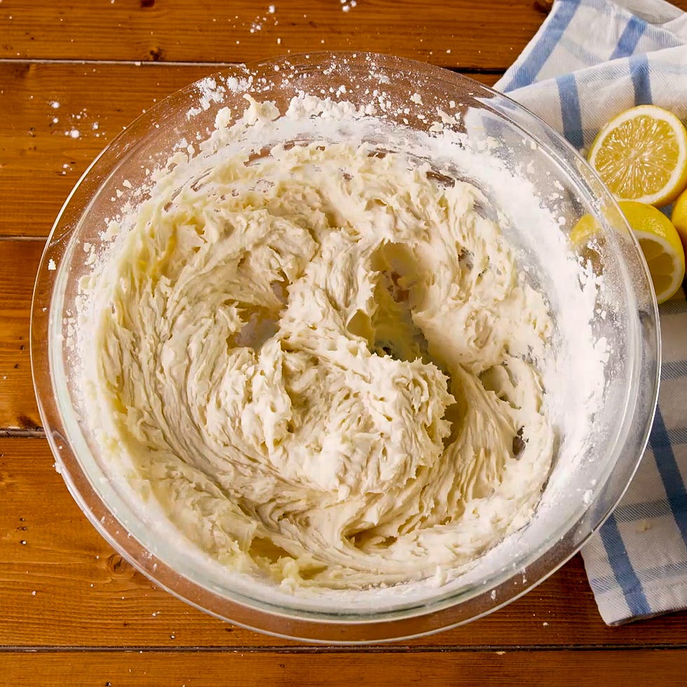 bowl of cake batter on a wooden surface