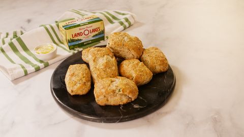 preview for Herby Garlic Butter Biscuits | Delish + Land O'Lakes