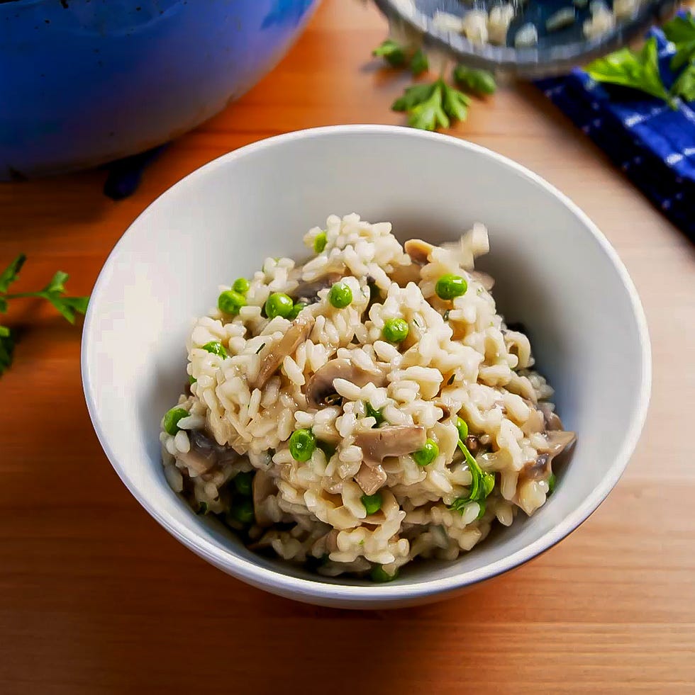 risotto and peas and mushrooms in a bowl