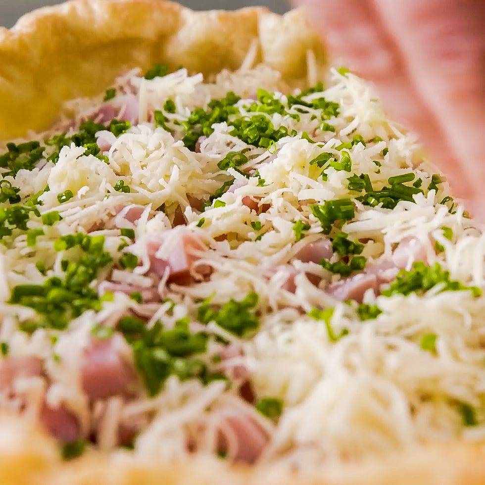 a closeup view of a pastry shell filled with toppings