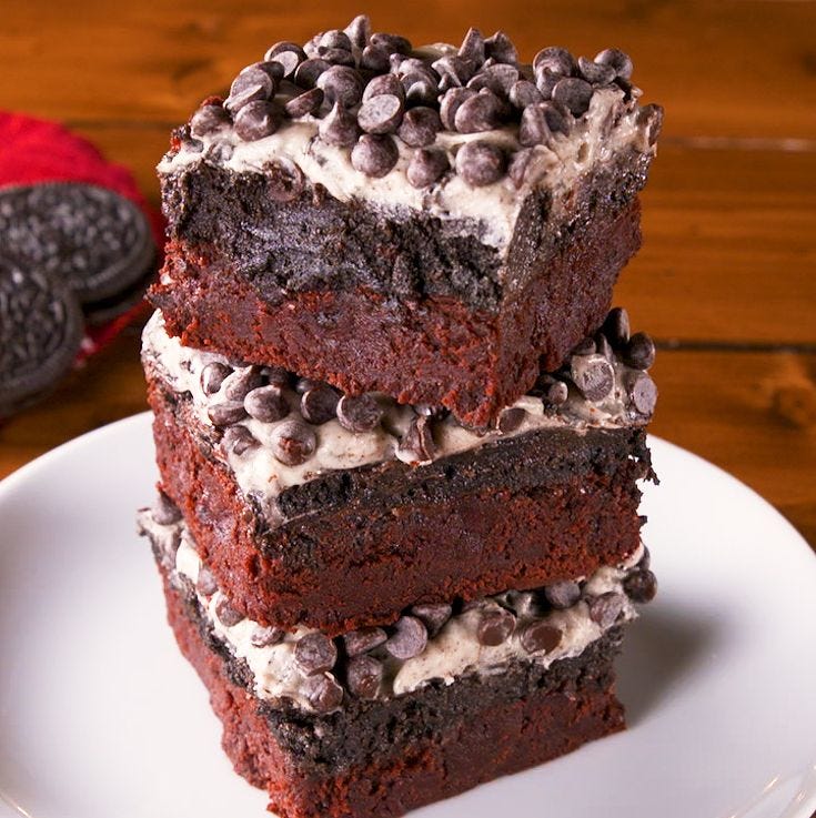 red velvet oreo brownies stacked on white plate