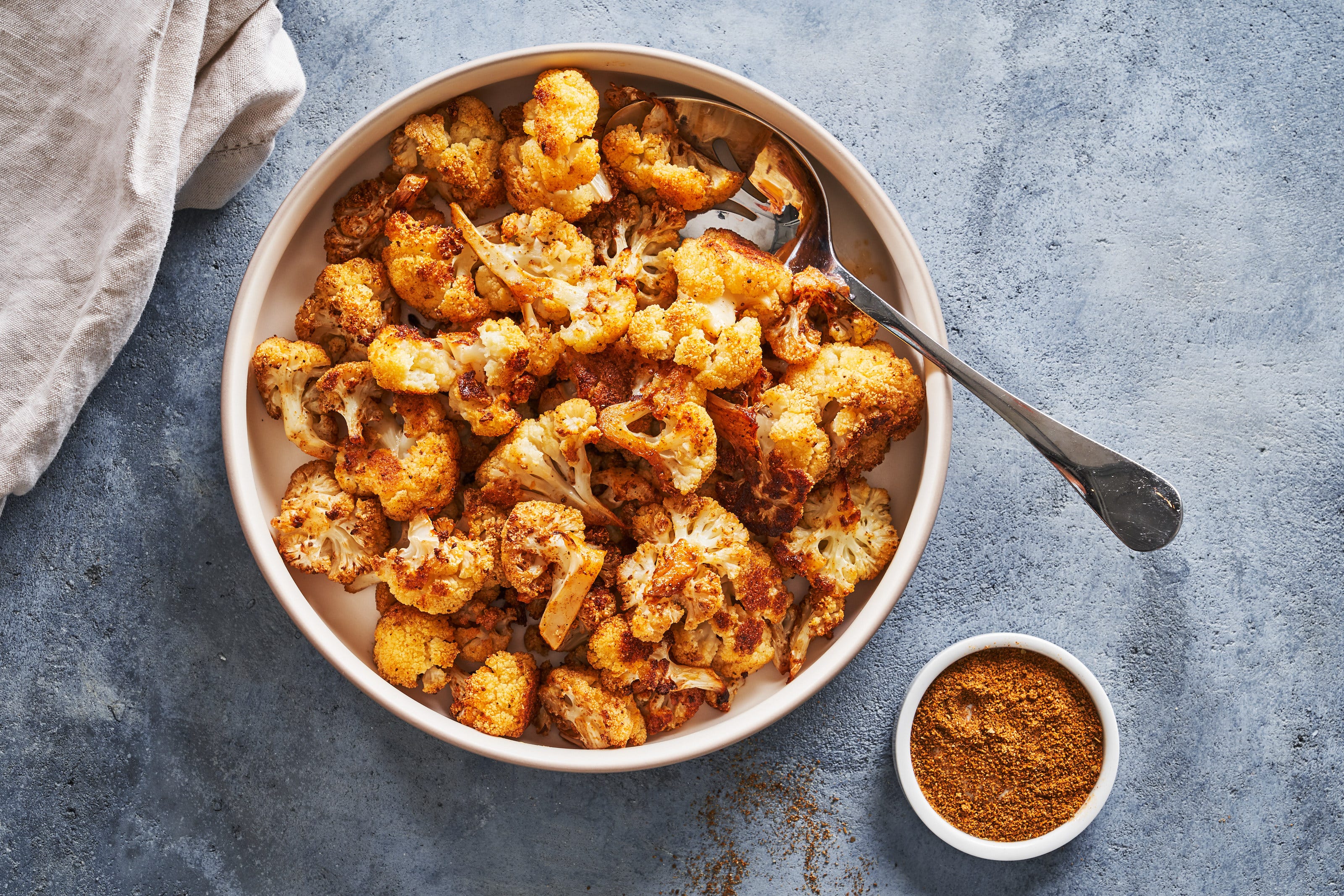 https://hips.hearstapps.com/hmg-prod/images/delish-roasted-cauliflower-1634850047.jpg?crop=1xw:0.8434864104967198xh;center,top