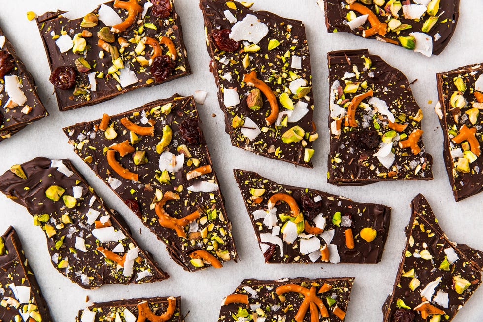 chocolate bark topped with coconut flakes, pretzels, pistachios, and dried cranberries
