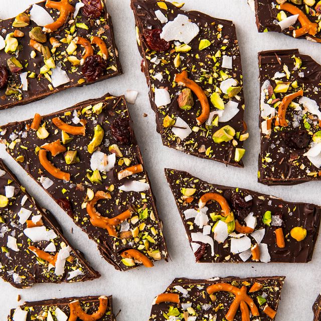 chocolate bark topped with coconut flakes, pretzels, pistachios, and dried cranberries