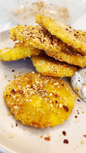 seasoned tostones with a side of vegan lime sour cream