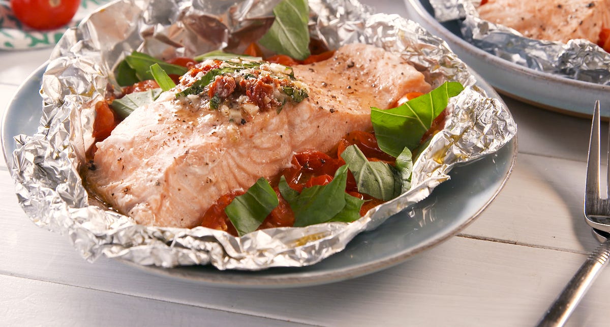 Video player poster image preview for We'll Be Making These Tuscan Butter Salmon Foil Packs All Year Long