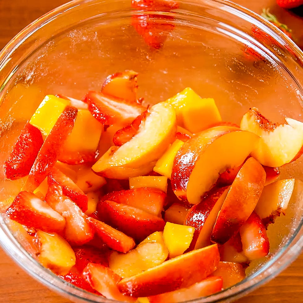 sliced fruits in a glass bowl