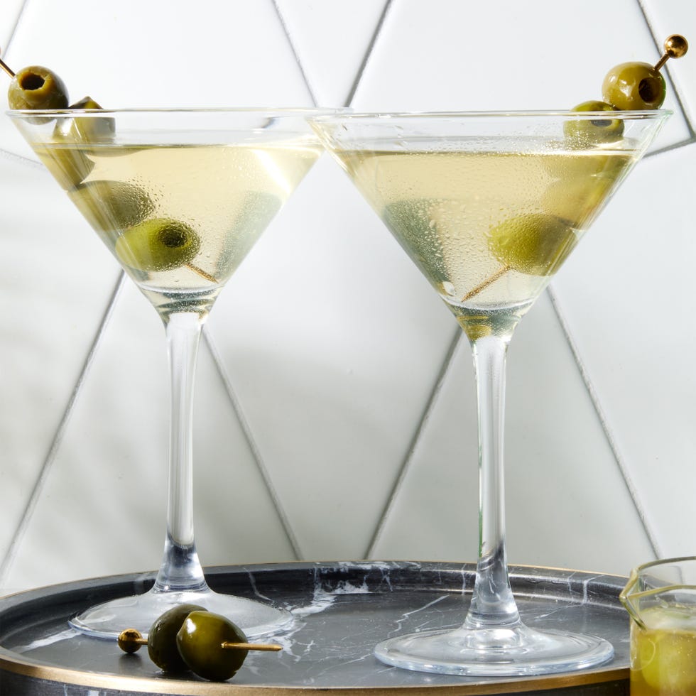 perfect dirty martini with chilled gin, dry vermouth, and olive brine