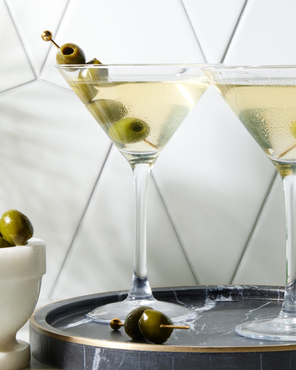 perfect dirty martini with chilled gin, dry vermouth, and olive brine