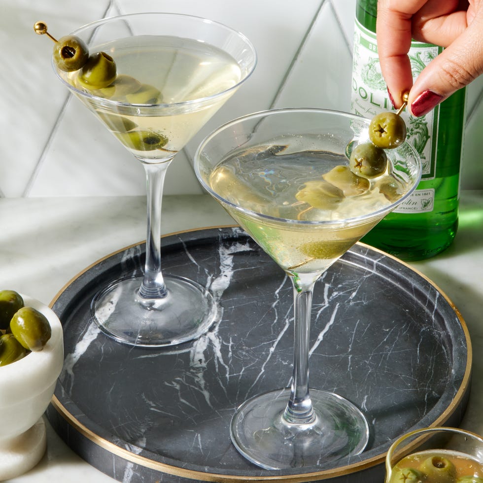 perfect dirty martini with chilled gin, dry vermouth, and olive brine