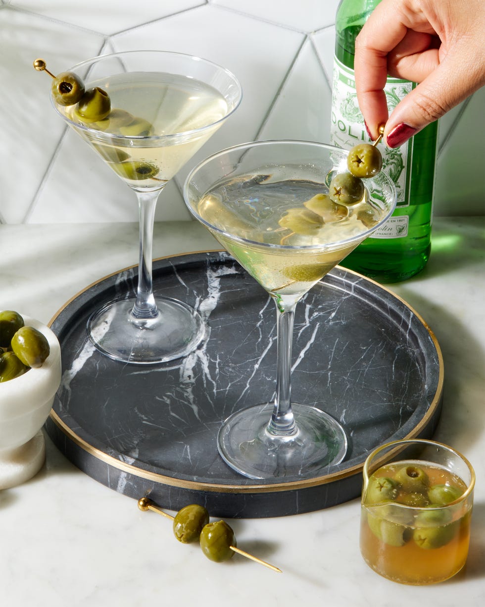 perfect dirty martini with chilled gin, dry vermouth, and olive brine