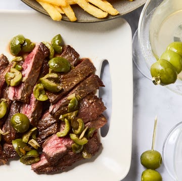 seared skirt steak topped with buttery green olive, gin, and vermouth sauce and served with crispy golden french fries