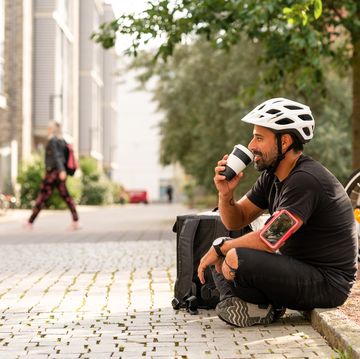 a delivery man is taking a break from riding his bike, black tea healthy aging