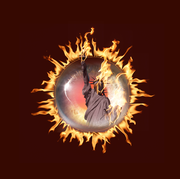 eyeball featuring the statue of liberty surrounded by flames