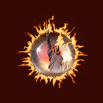 eyeball featuring the statue of liberty surrounded by flames