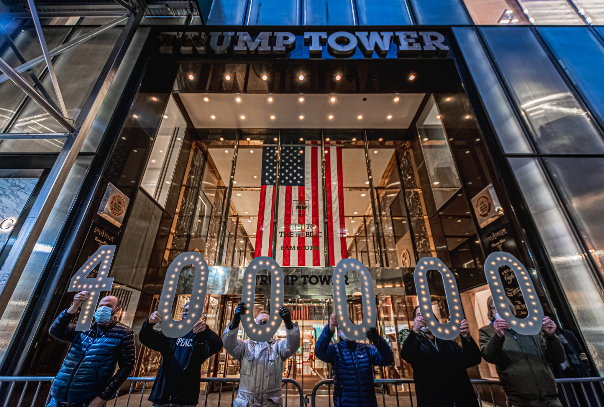 demonstrators gathered outside trump tower in manhattan to