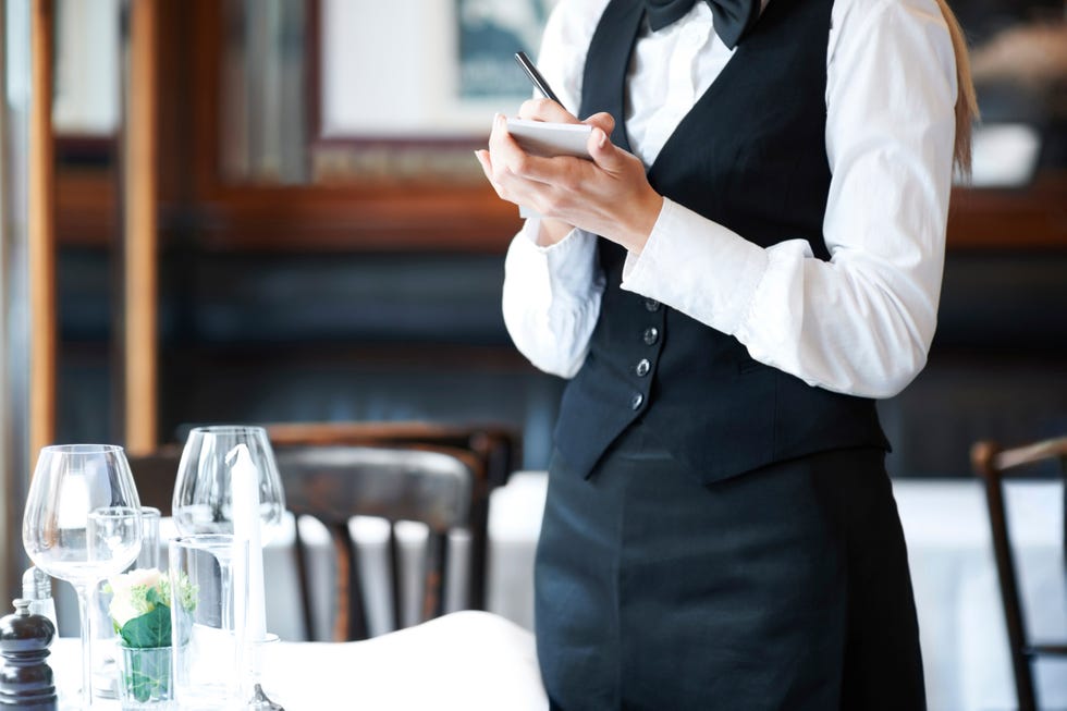 Denmark, Aarhus, young waitress takes order