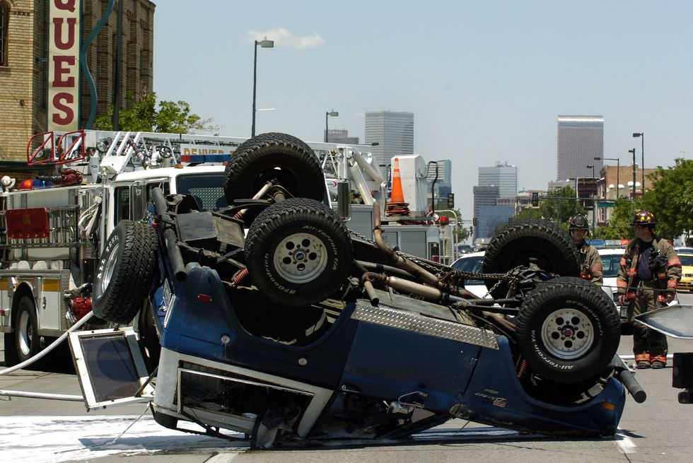 denver, co, june 26, 2006   duane collins of denver's 1969 ford bronco fliped by an accident at the corner of broadway and dakota ave in denver on monday denver post photo by hyoung chang