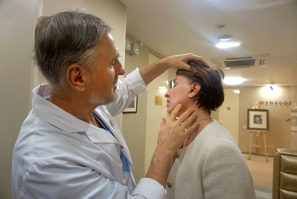 dr denyshchuk with his patient olga saienko at her one month post op check up