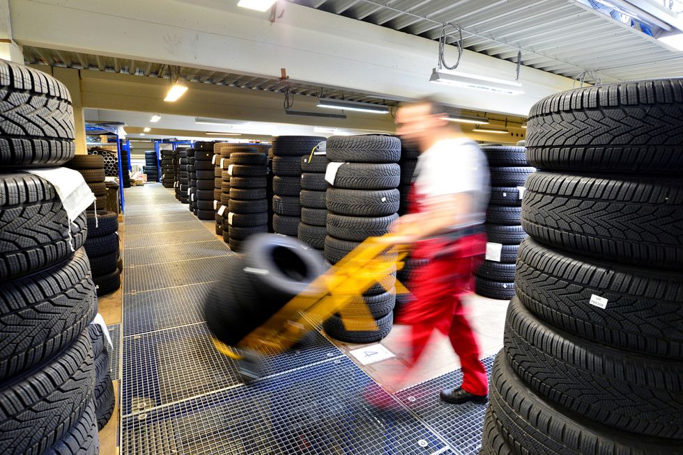 department store with car tyres in a garage   tyre change
