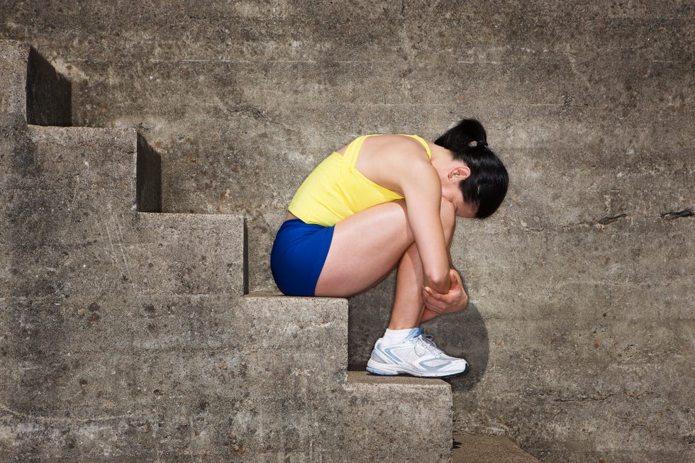 Depressed Woman Sitting on Stairway