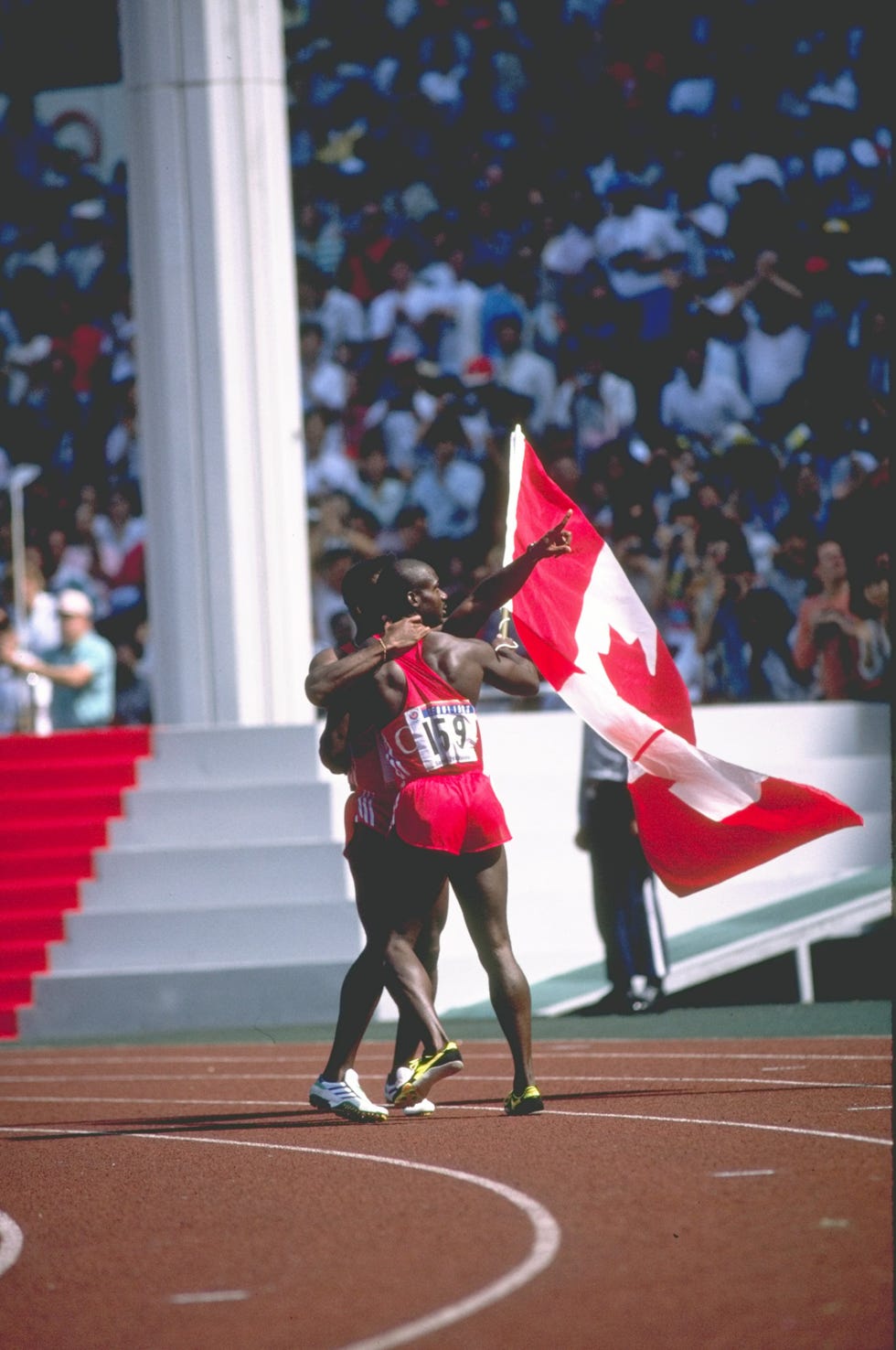desai williams congratulates ben johnson after johnson's win in the 100 metres fin