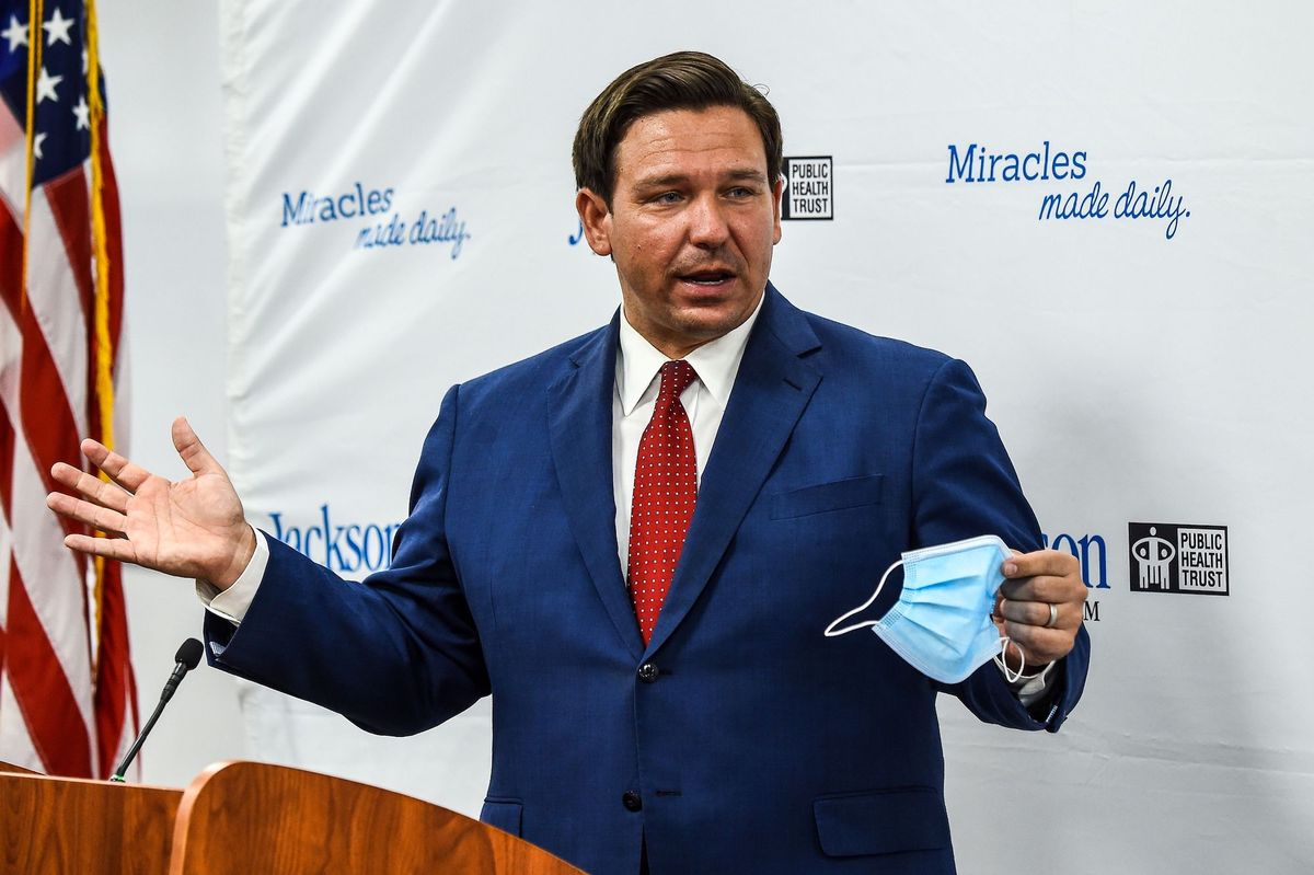 florida gov ron desantis speaks holding his facemask during a press conference to address the rise of coronavirus cases in the state, at jackson memorial hospital in miami, on july 13, 2020   virus epicenter florida saw 12,624 new cases on july 12    the second highest daily count recorded by any state, after its own record of 15,300 new covid 19 cases a day earlier photo by chandan khanna  afp photo by chandan khannaafp via getty images