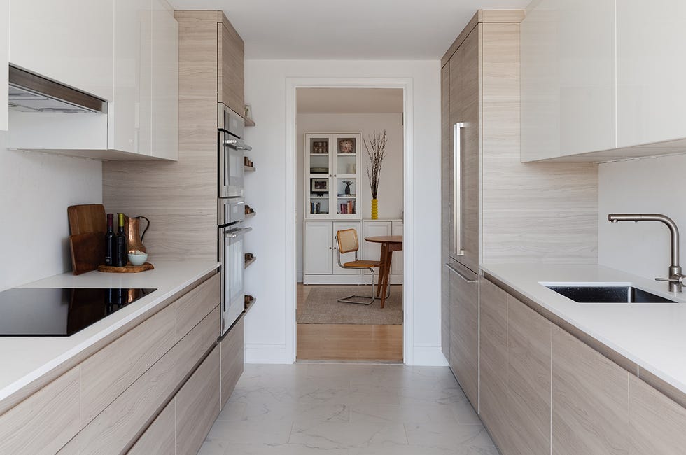 modern kitchen with wooden cabinetry and an open layout