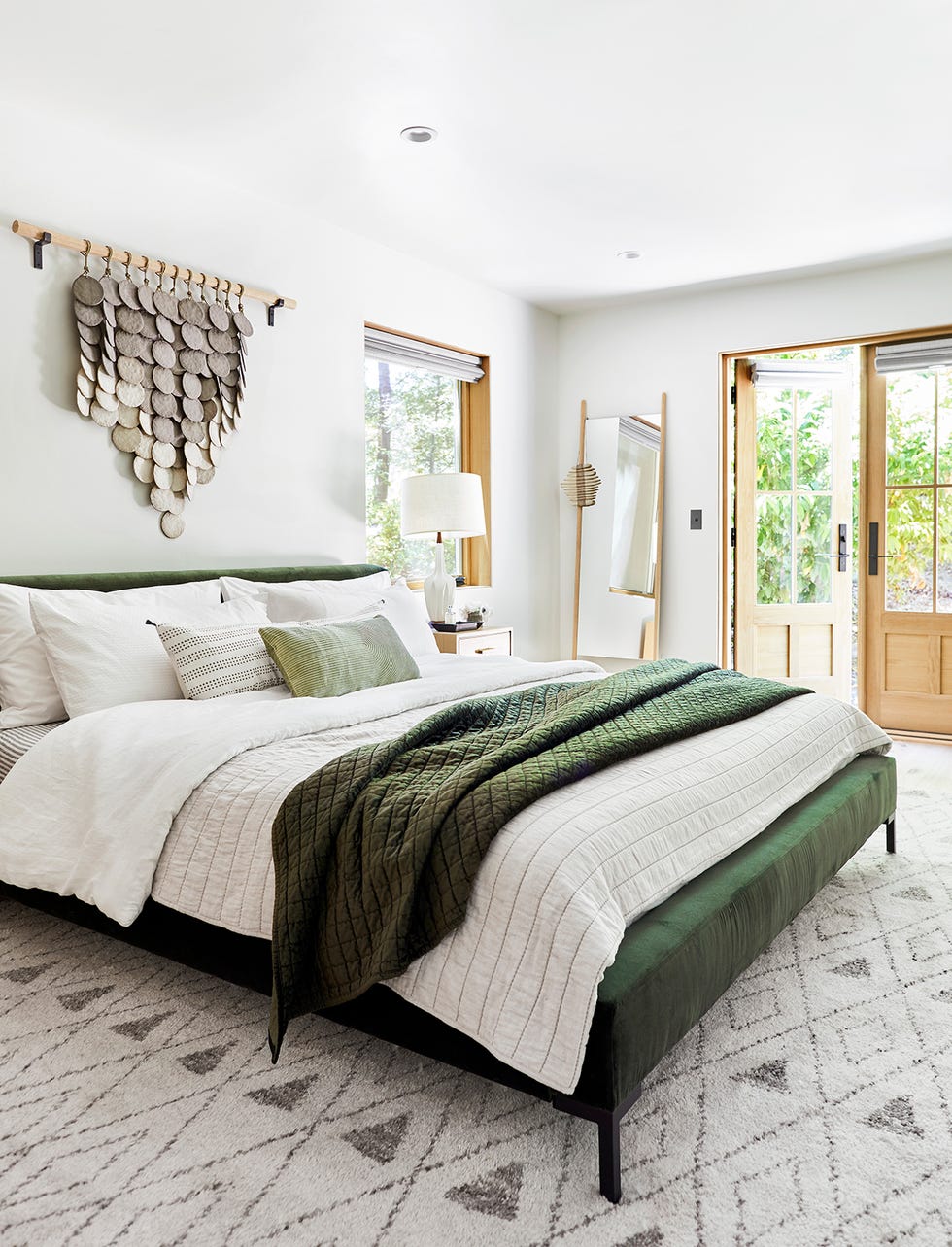 bedroom featuring a modern design with a bed decorative wall art and large windows