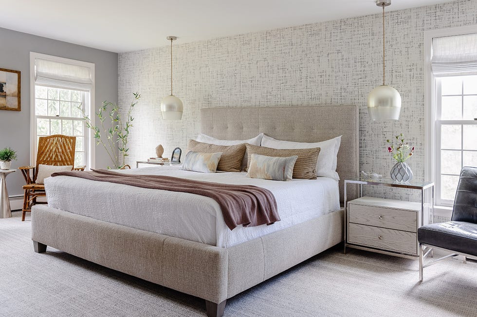 Contemporary bedroom featuring a large bed decorative pillows and modern furniture contemporary bedroom featuring a large bed decorative pillows and modern furniture