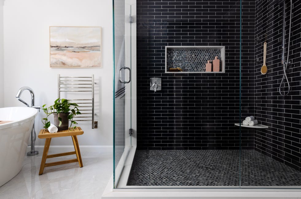 bathroom with large black shower tiles