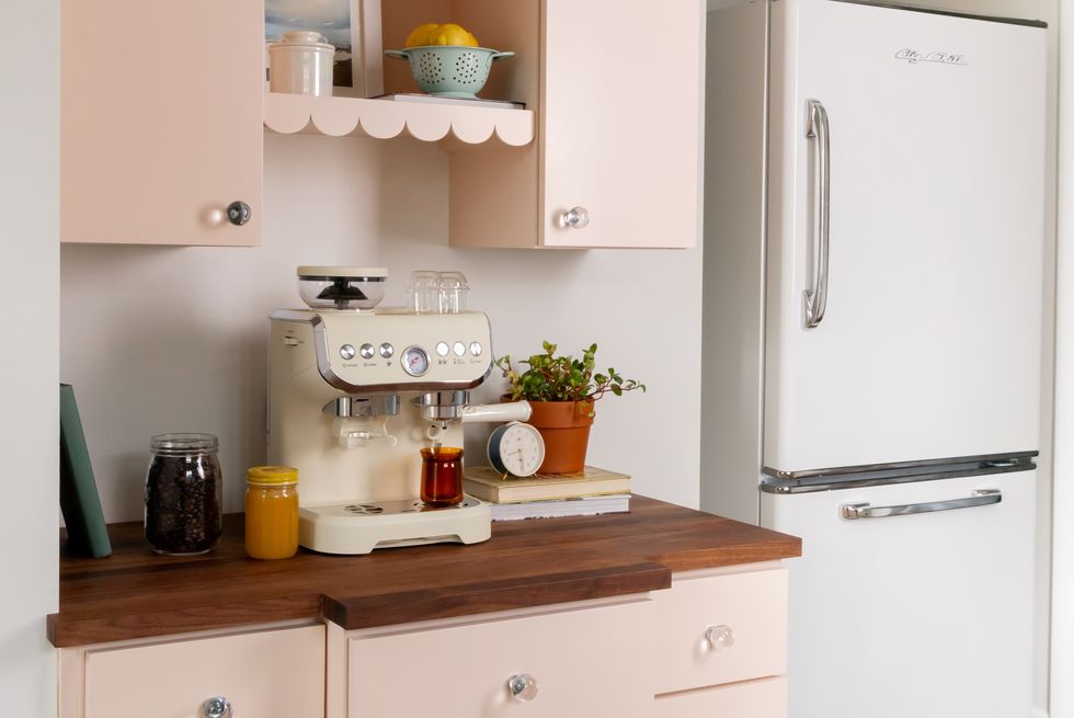 retro style kitchen with blush pink cabinets