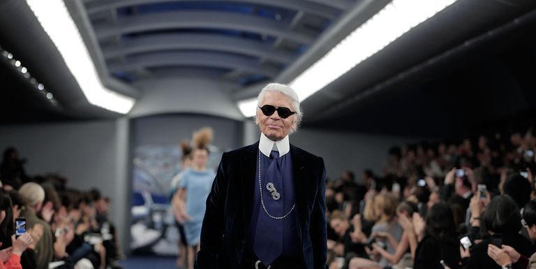 A model, sunglasses detail, walks the runway at the Fendi show