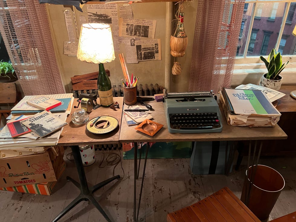 Home office workplace with vintage typewriter and various office supplies