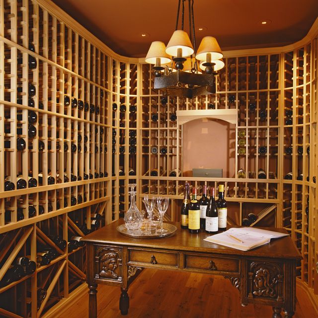 desk and chandelier in wine cellar