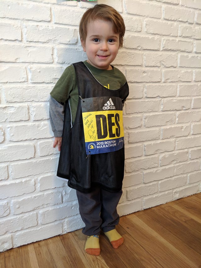 Clothing, Standing, Yellow, Child, Outerwear, T-shirt, Toddler, Footwear, Sleeve, Jacket, 