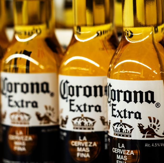 Detail of lined up Corona beer bottles seen on the store...