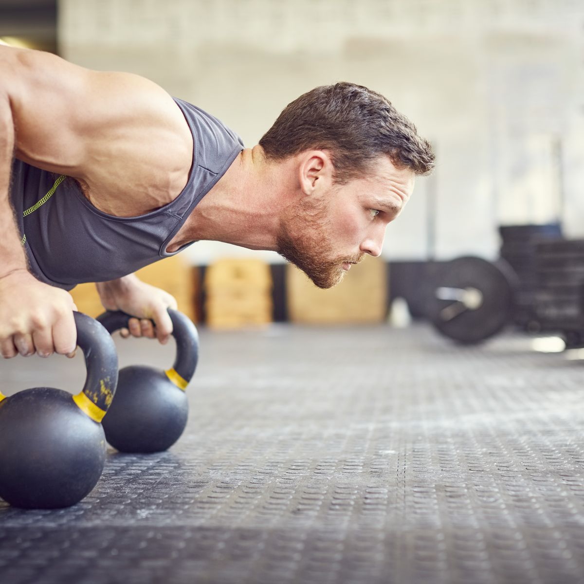 https://hips.hearstapps.com/hmg-prod/images/determined-athlete-doing-push-ups-on-kettlebells-in-royalty-free-image-1585654820.jpg?crop=0.652xw:1.00xh;0.0321xw,0&resize=1200:*