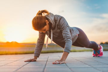 determined woman doing push ups