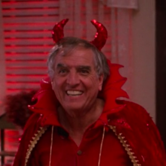 Red, Facial expression, Fun, Smile, Temple, Outerwear, Room, Costume, Fictional character, 