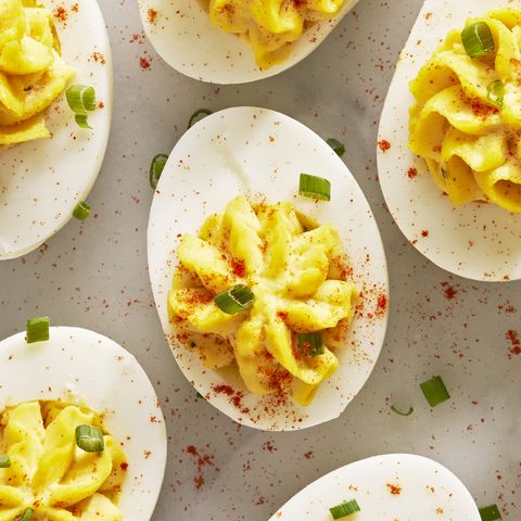 deviled eggs with paprika and sliced chives