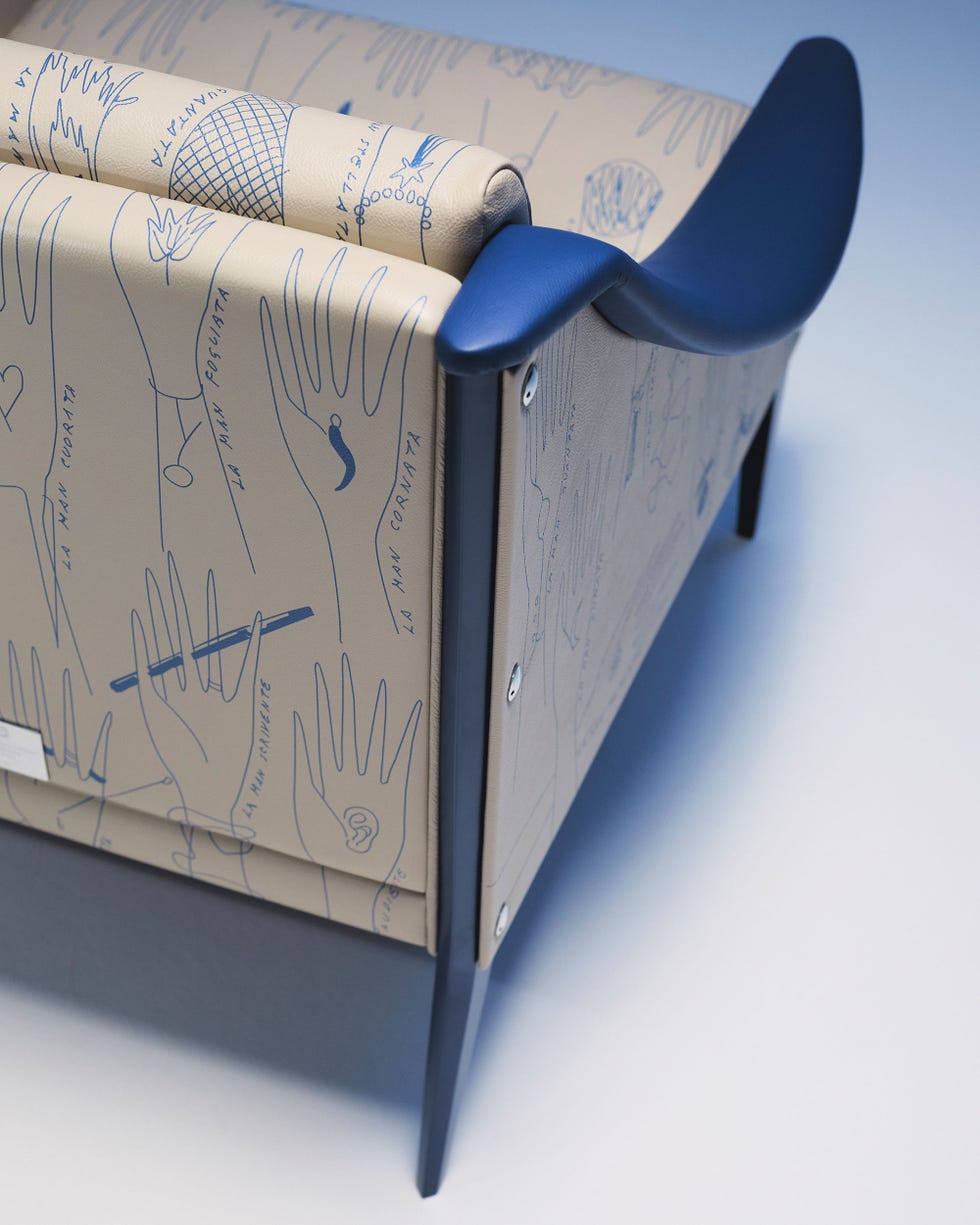 stylish sofa with handdrawn illustrations on the upholstery