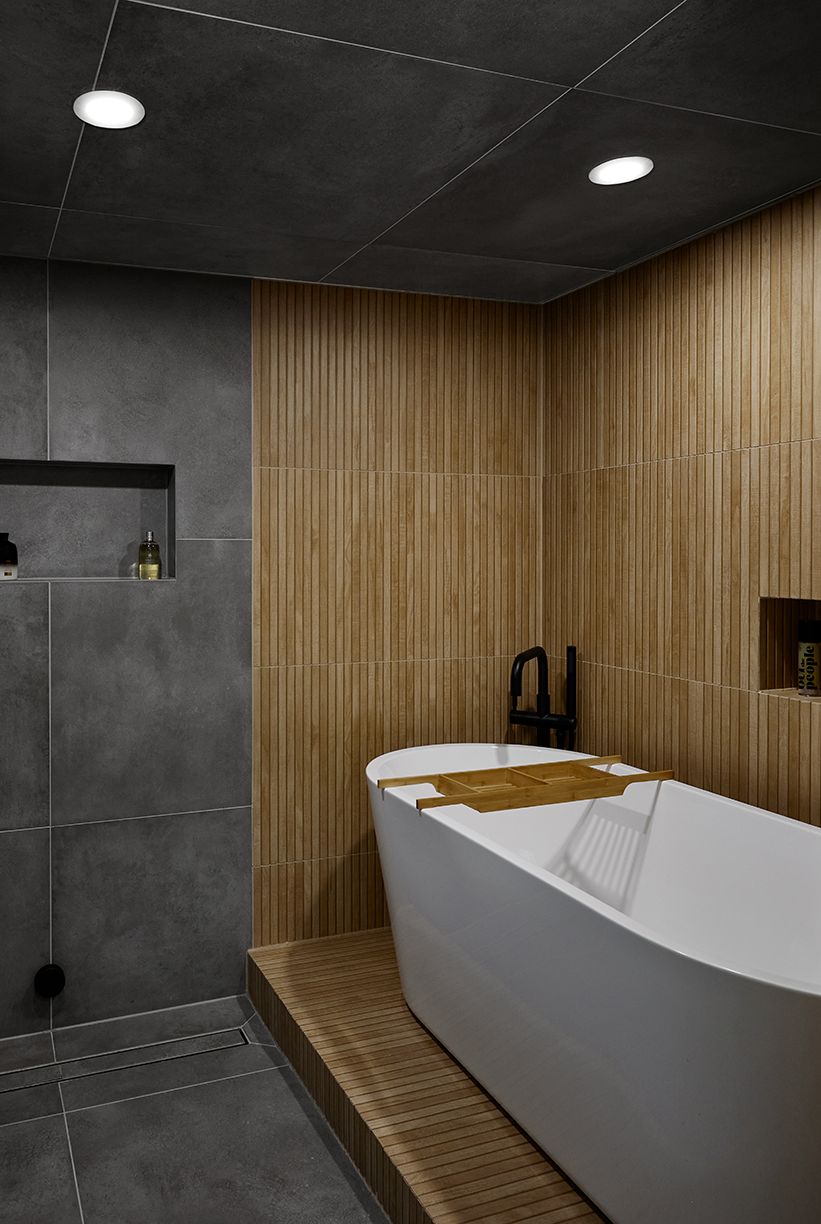 a bathroom with a tub and shower area