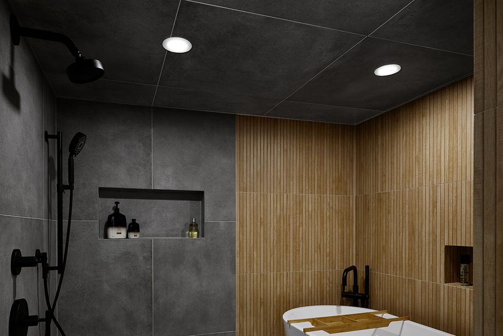a bathroom with a tub and shower area