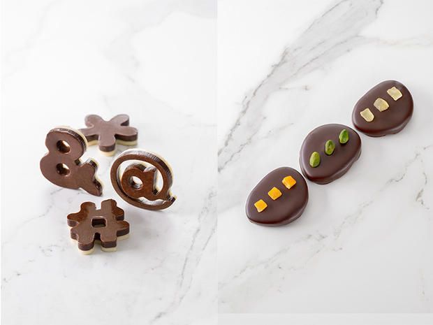 Brown, Chocolate, Food, Fashion accessory, Dessert, Snack, Praline, Chocolate letter, Sweetness, Baked goods, 