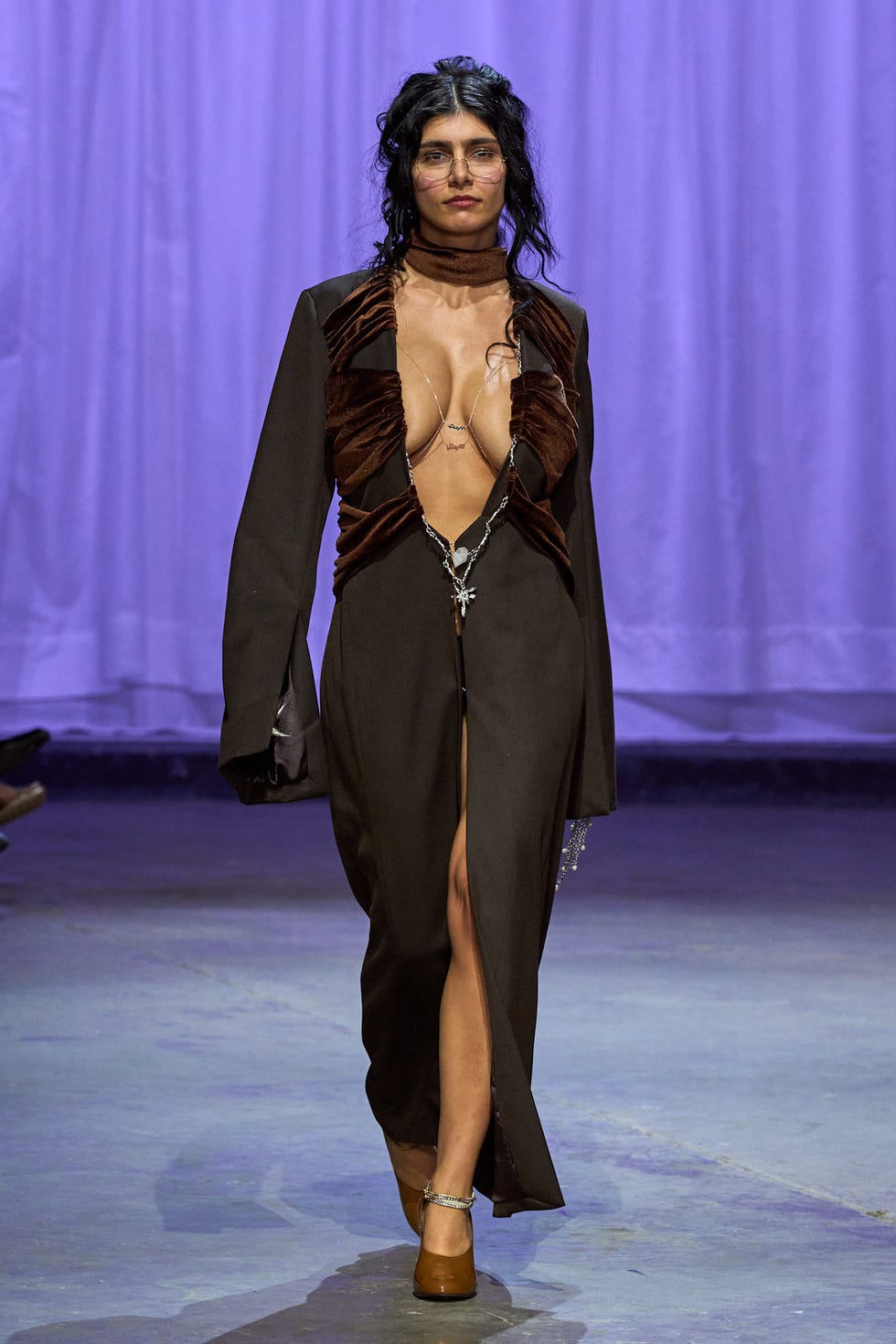 fashion model showcasing a daring outfit on the runway